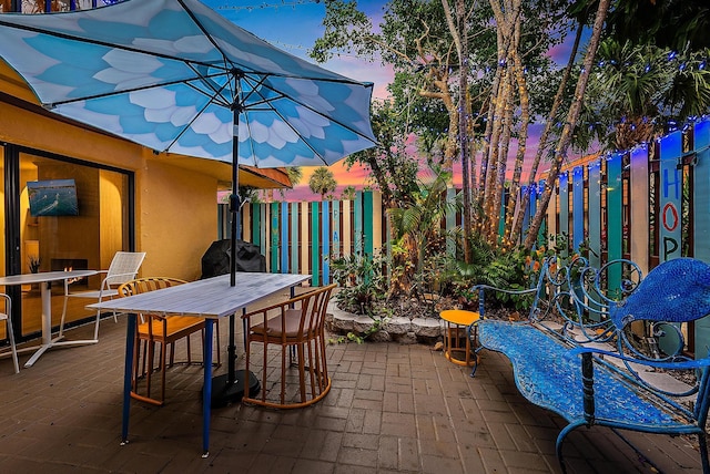 patio terrace at dusk with area for grilling