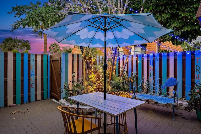 view of patio terrace at dusk