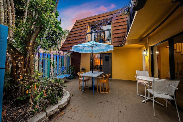 view of patio terrace at dusk