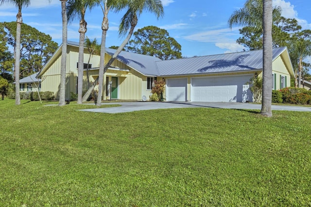 ranch-style home featuring a garage and a front lawn