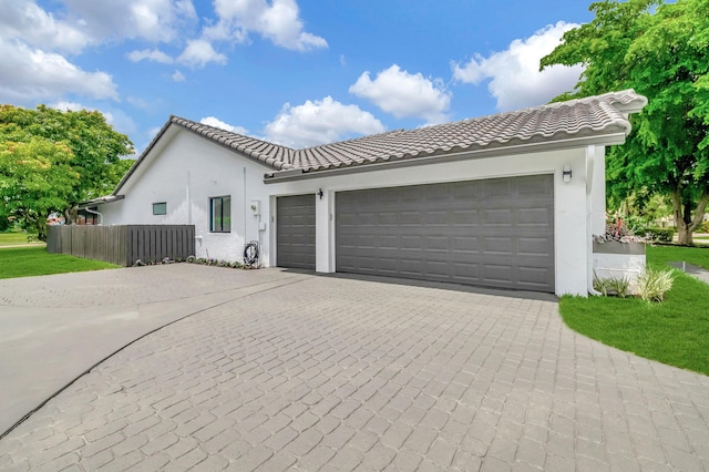 view of front of property with a garage