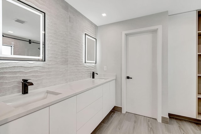 bathroom with vanity and a healthy amount of sunlight