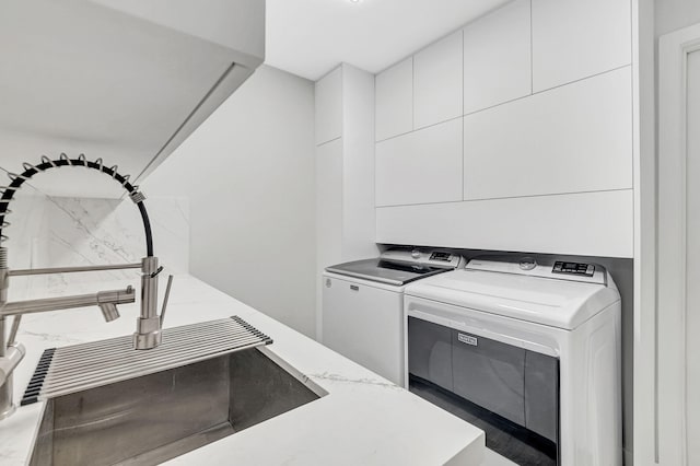 laundry room with independent washer and dryer