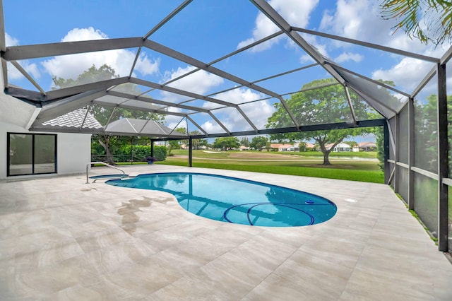 view of pool featuring a lanai, a lawn, and a patio