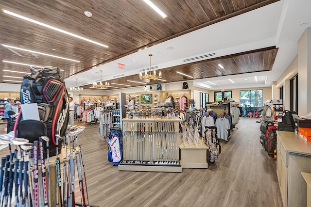 exercise room with wooden ceiling and hardwood / wood-style flooring