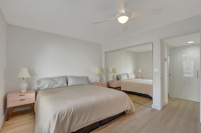 bedroom featuring light hardwood / wood-style flooring, a closet, and ceiling fan