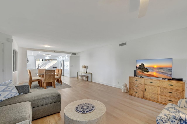 living room with light hardwood / wood-style flooring