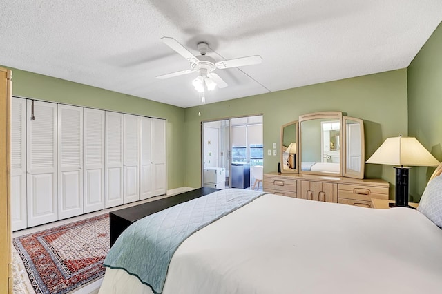 bedroom featuring ceiling fan and a textured ceiling