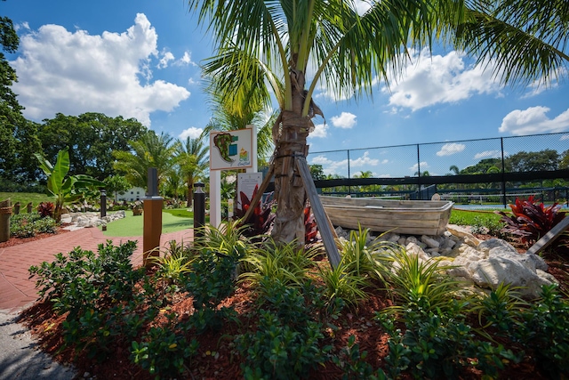 view of playground with tennis court