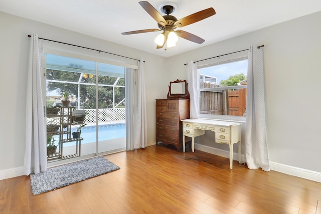 interior space with ceiling fan and light hardwood / wood-style flooring