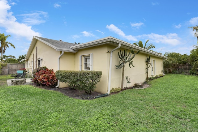 view of home's exterior featuring a lawn