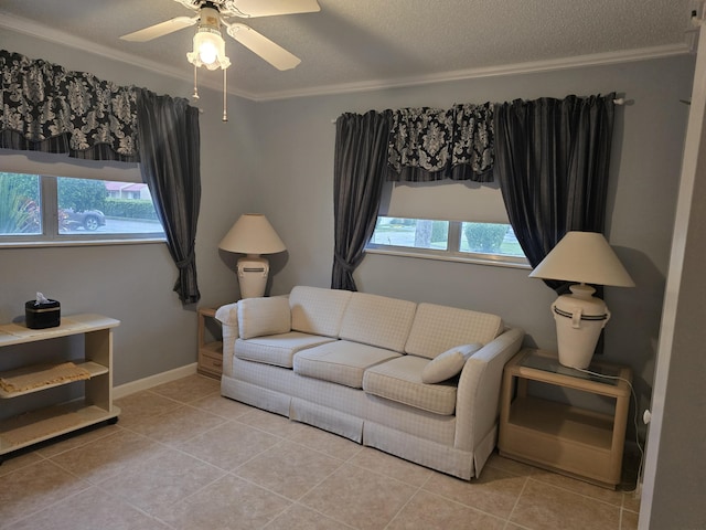 tiled living room with ceiling fan, crown molding, and a textured ceiling