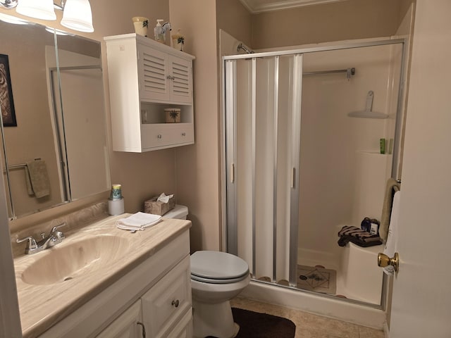 bathroom featuring tile patterned floors, an enclosed shower, vanity, and toilet