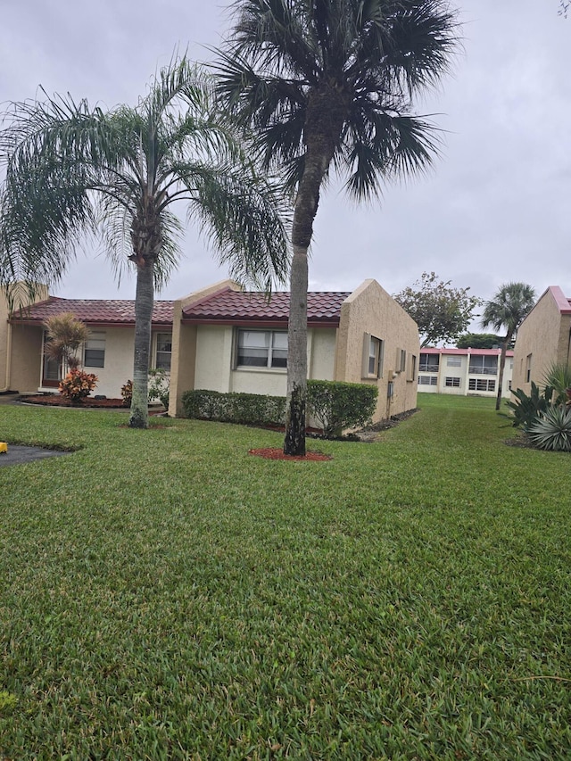 exterior space featuring a front lawn