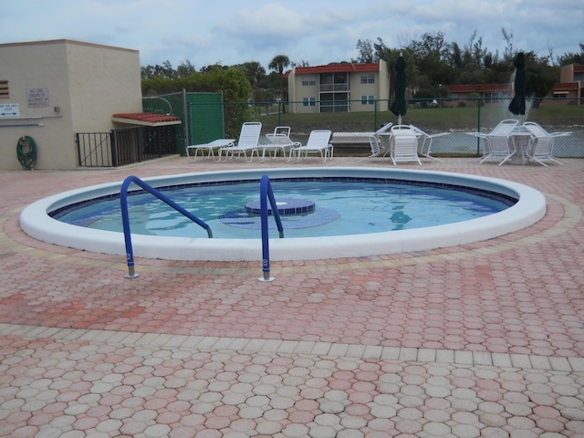 view of swimming pool featuring a patio area