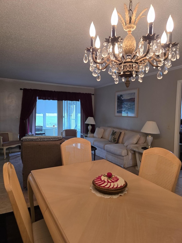 dining space featuring a textured ceiling, a chandelier, and ornamental molding