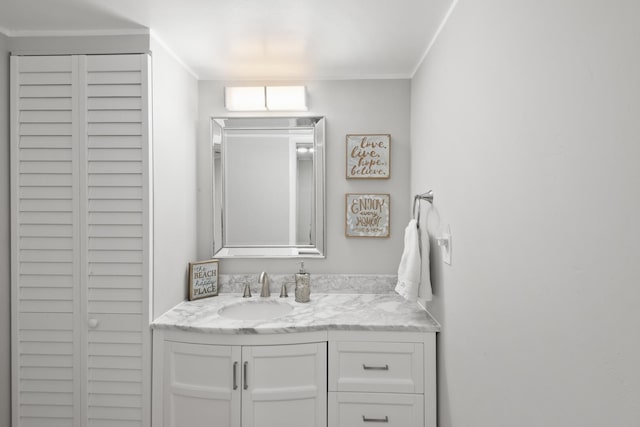 bathroom featuring vanity and crown molding