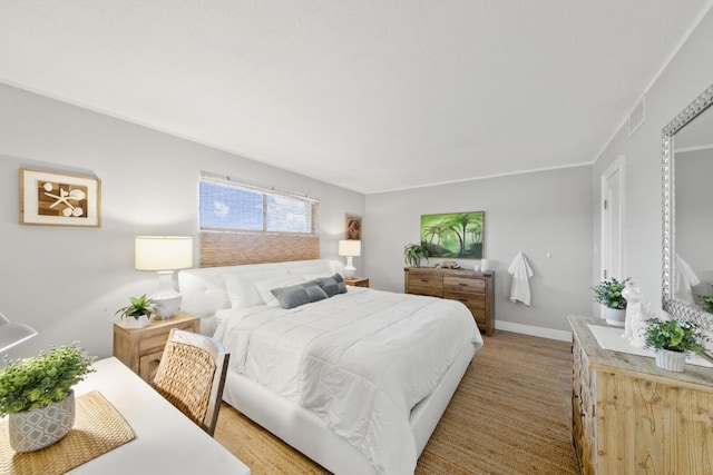 bedroom with light hardwood / wood-style flooring