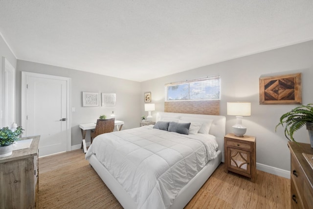 bedroom with light hardwood / wood-style floors