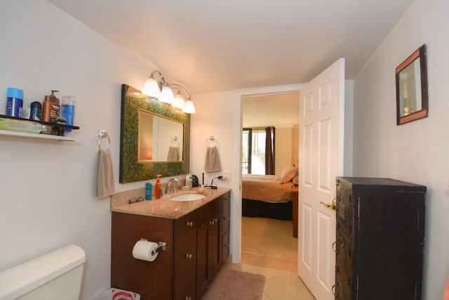 bathroom with vanity, tile patterned floors, and toilet