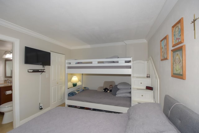 bedroom featuring carpet floors, crown molding, sink, and a closet