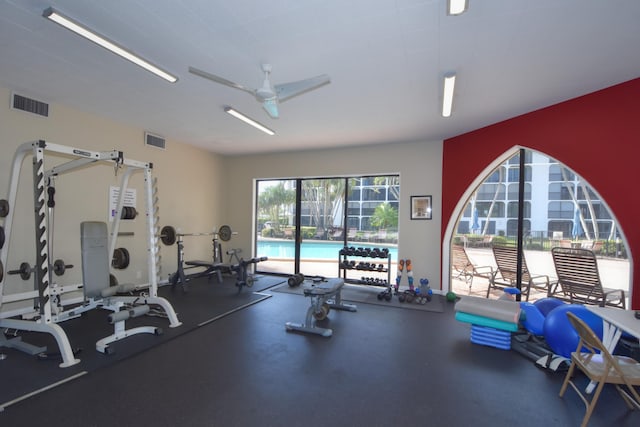 exercise room with ceiling fan