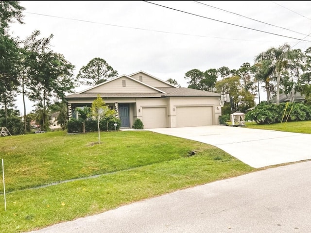 view of front of home featuring a garage and a front yard