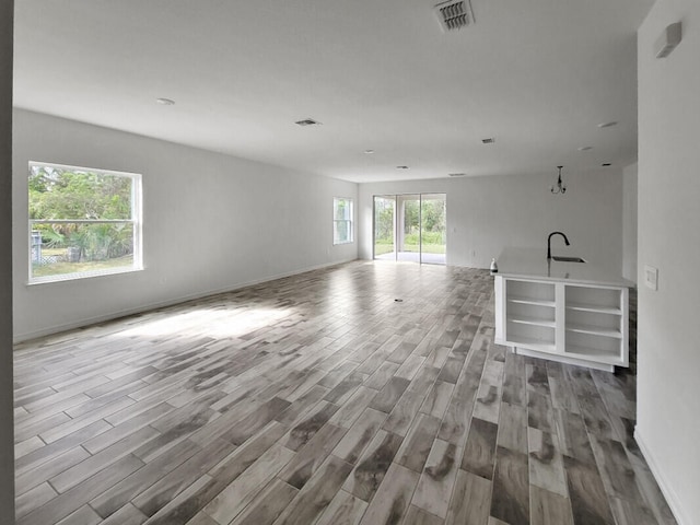 unfurnished living room featuring light wood-type flooring