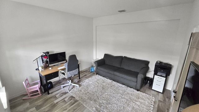 office area with wood-type flooring