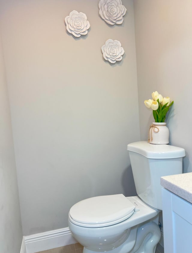 bathroom with toilet and vanity