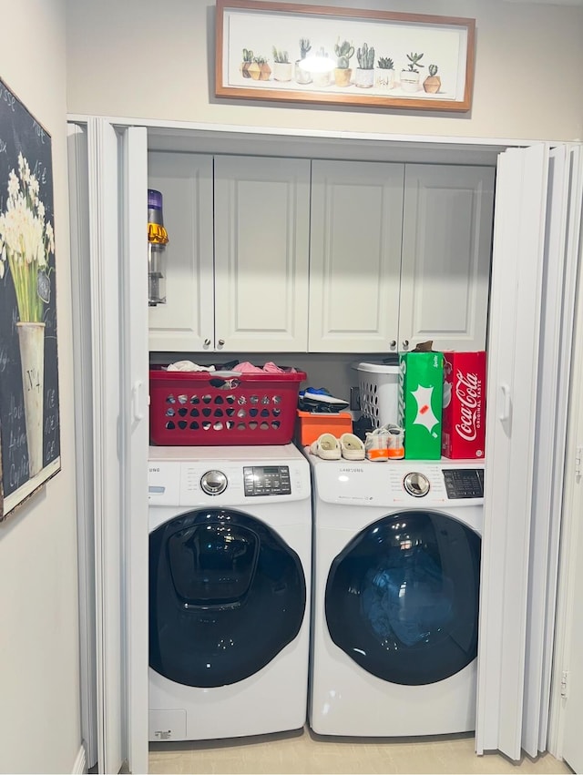 laundry area with cabinets and separate washer and dryer