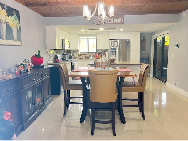 dining area featuring wood ceiling, an inviting chandelier, sink, light tile patterned floors, and beam ceiling