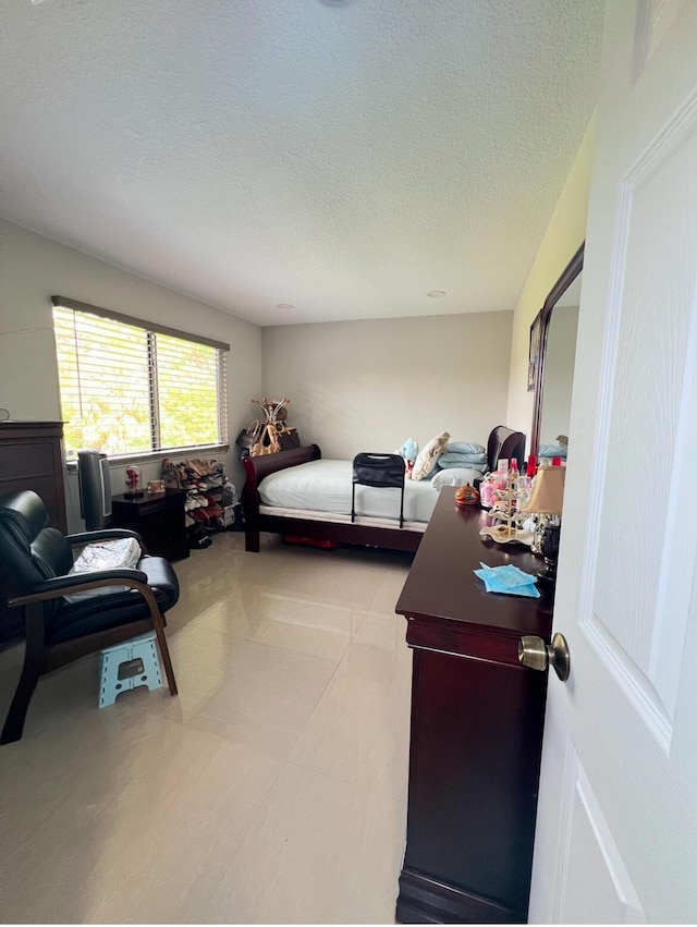 bedroom featuring a textured ceiling