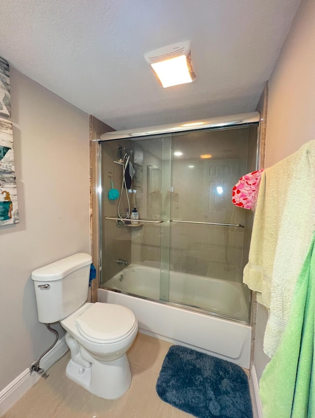 bathroom with toilet, tile patterned flooring, and enclosed tub / shower combo