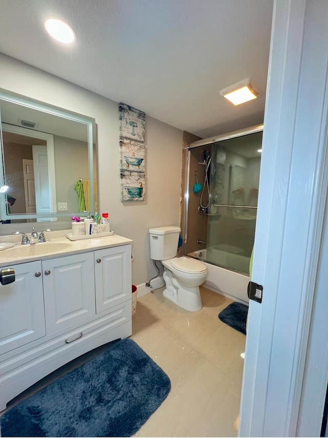 full bathroom with shower / bath combination with glass door, vanity, and toilet