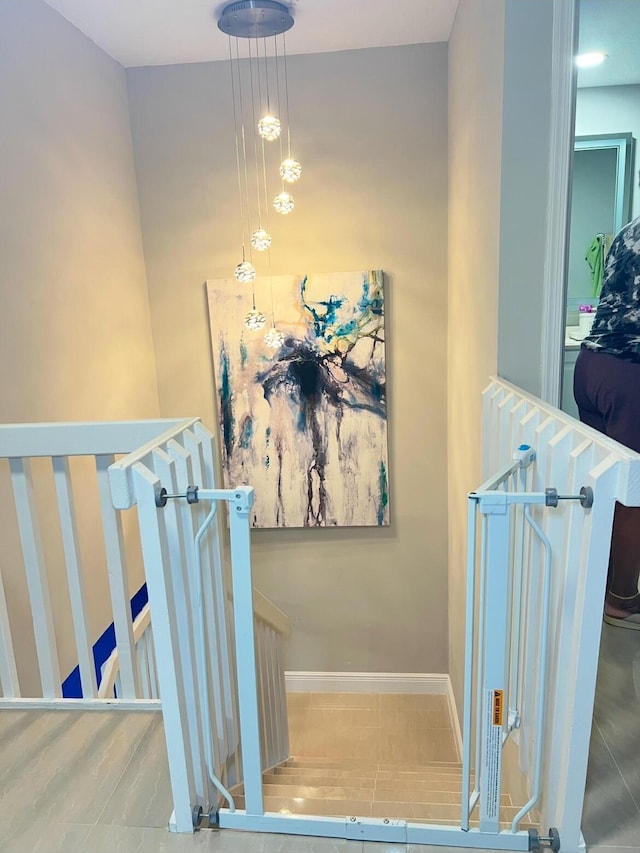 stairs featuring tile patterned flooring