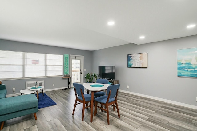 dining area with light hardwood / wood-style flooring