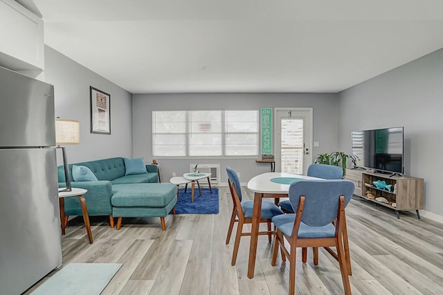 dining space with light wood-type flooring