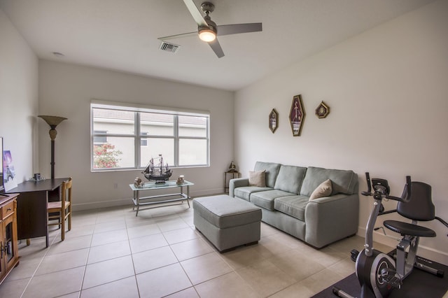 living room featuring ceiling fan and light tile patterned floors