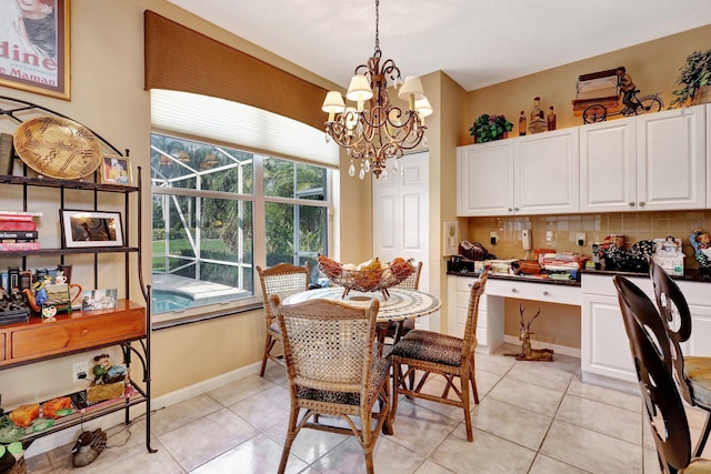 dining space featuring light tile patterned flooring and a chandelier