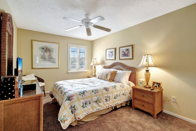 bedroom featuring ceiling fan, carpet flooring, and a textured ceiling