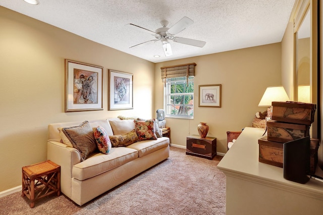 carpeted living room with a textured ceiling and ceiling fan