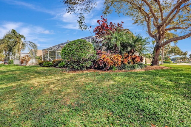 view of yard with a lanai