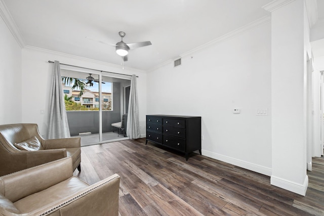 sitting room featuring ceiling fan, dark hardwood / wood-style floors, and crown molding