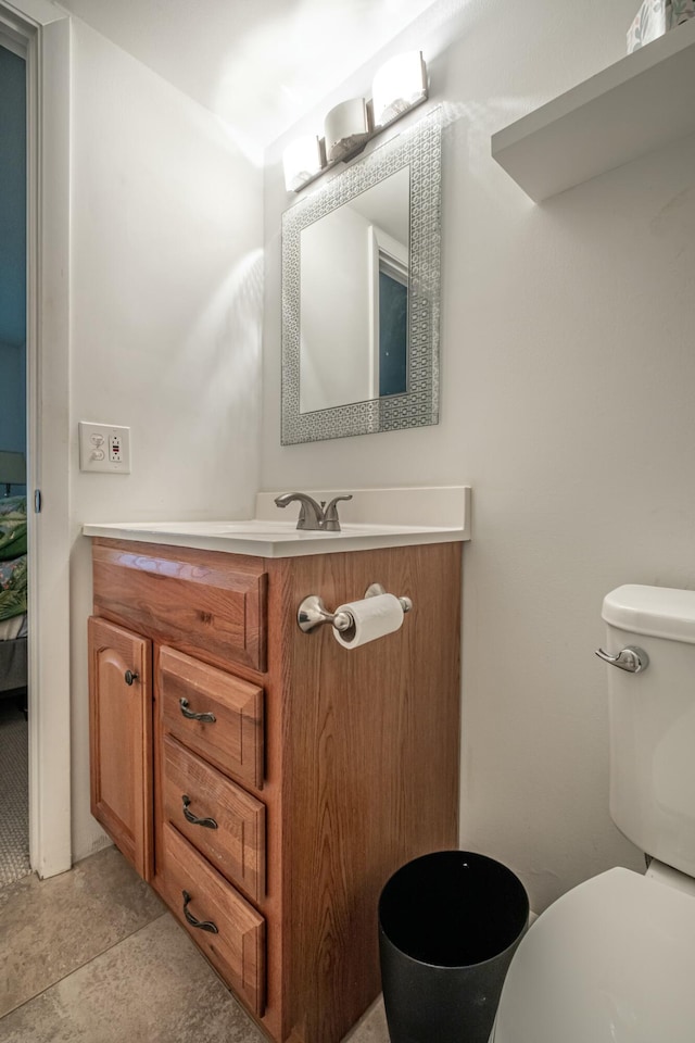 bathroom with vanity and toilet