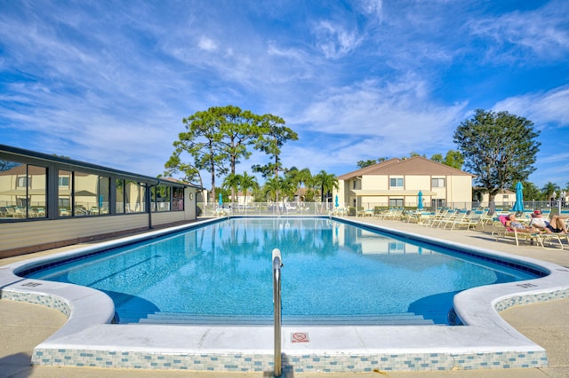 view of swimming pool with a patio