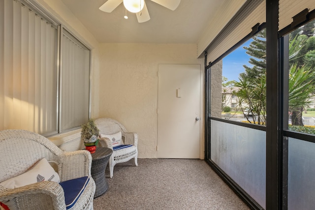 sunroom featuring ceiling fan