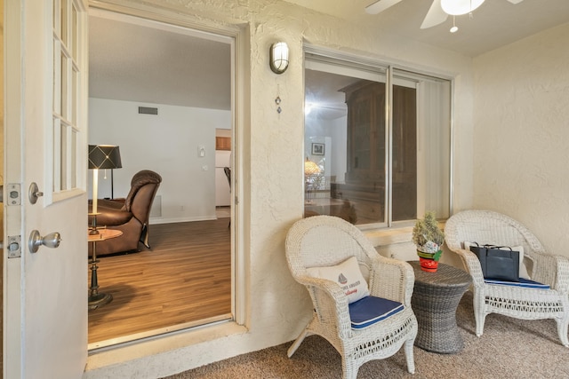 interior space featuring ceiling fan