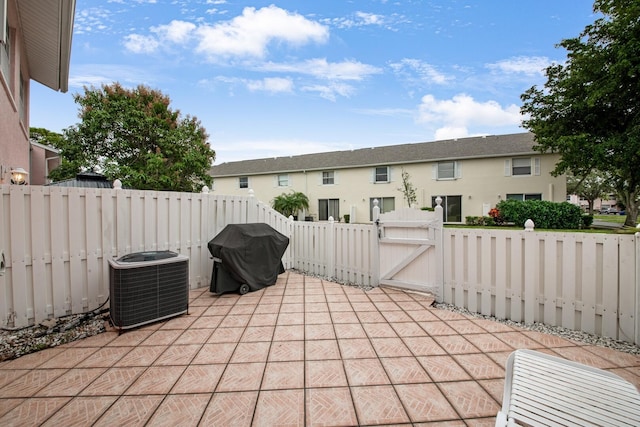 view of patio featuring central air condition unit and area for grilling