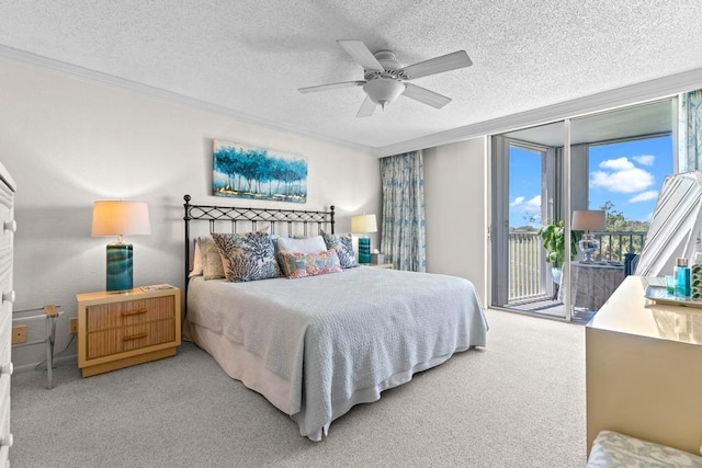 bedroom featuring ceiling fan, carpet, access to outside, a textured ceiling, and crown molding